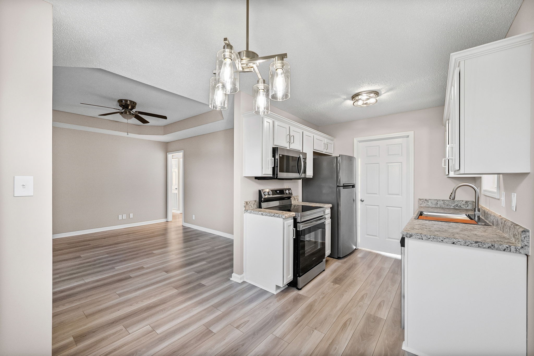 1010 Winesap Road Clarksville, TN 37040 - Photo 12 of 22 a kitchen with stove a sink and refrigerator