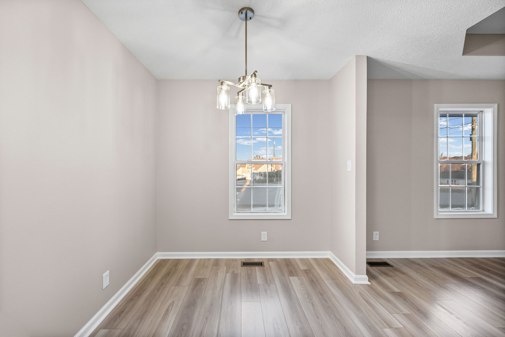 1010 Winesap Road Clarksville, TN 37040 - Photo 13 of 22 a view of an empty room with wooden floor and a window