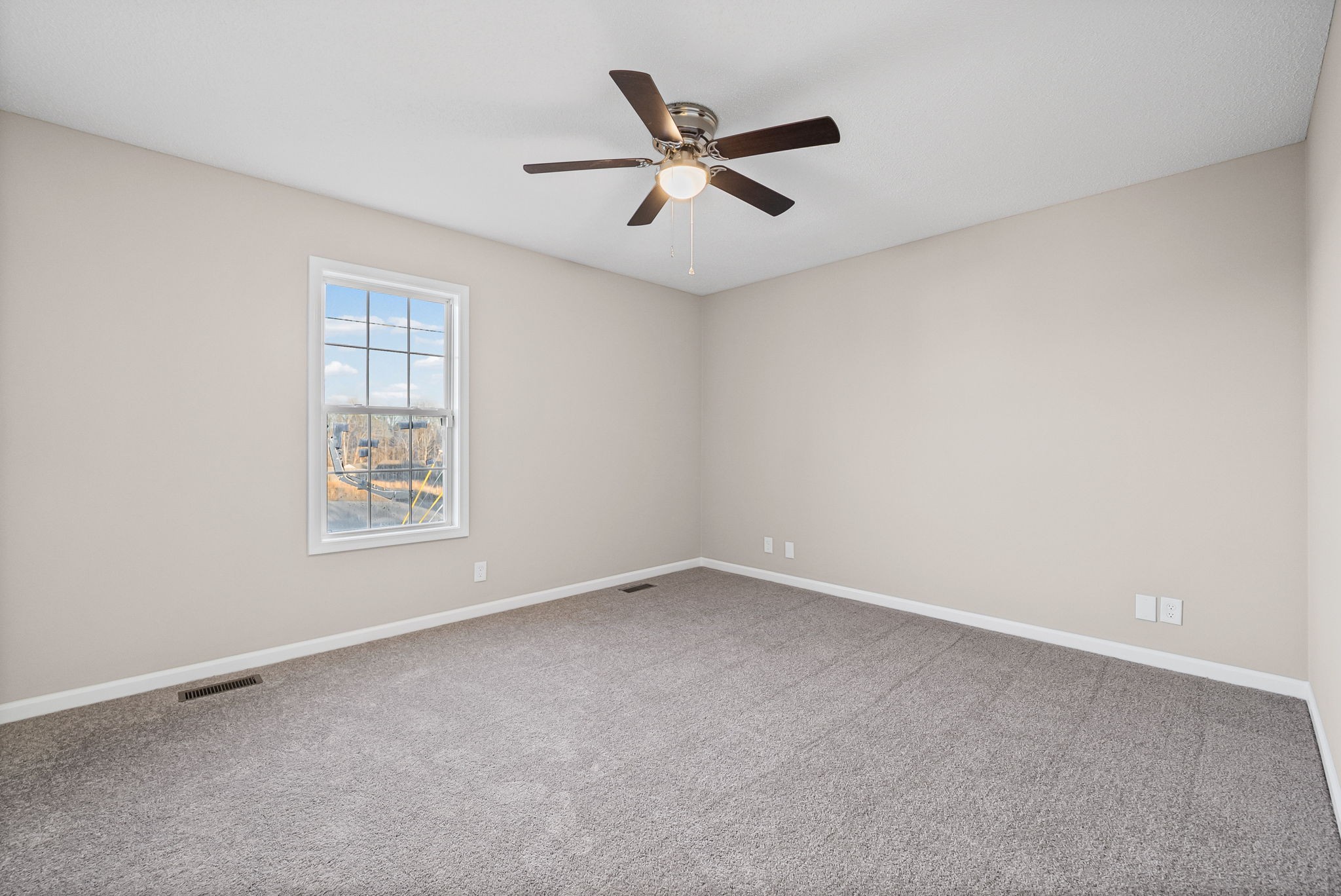 1010 Winesap Road Clarksville, TN 37040 - Photo 17 of 22 an empty room with ceiling fan and window