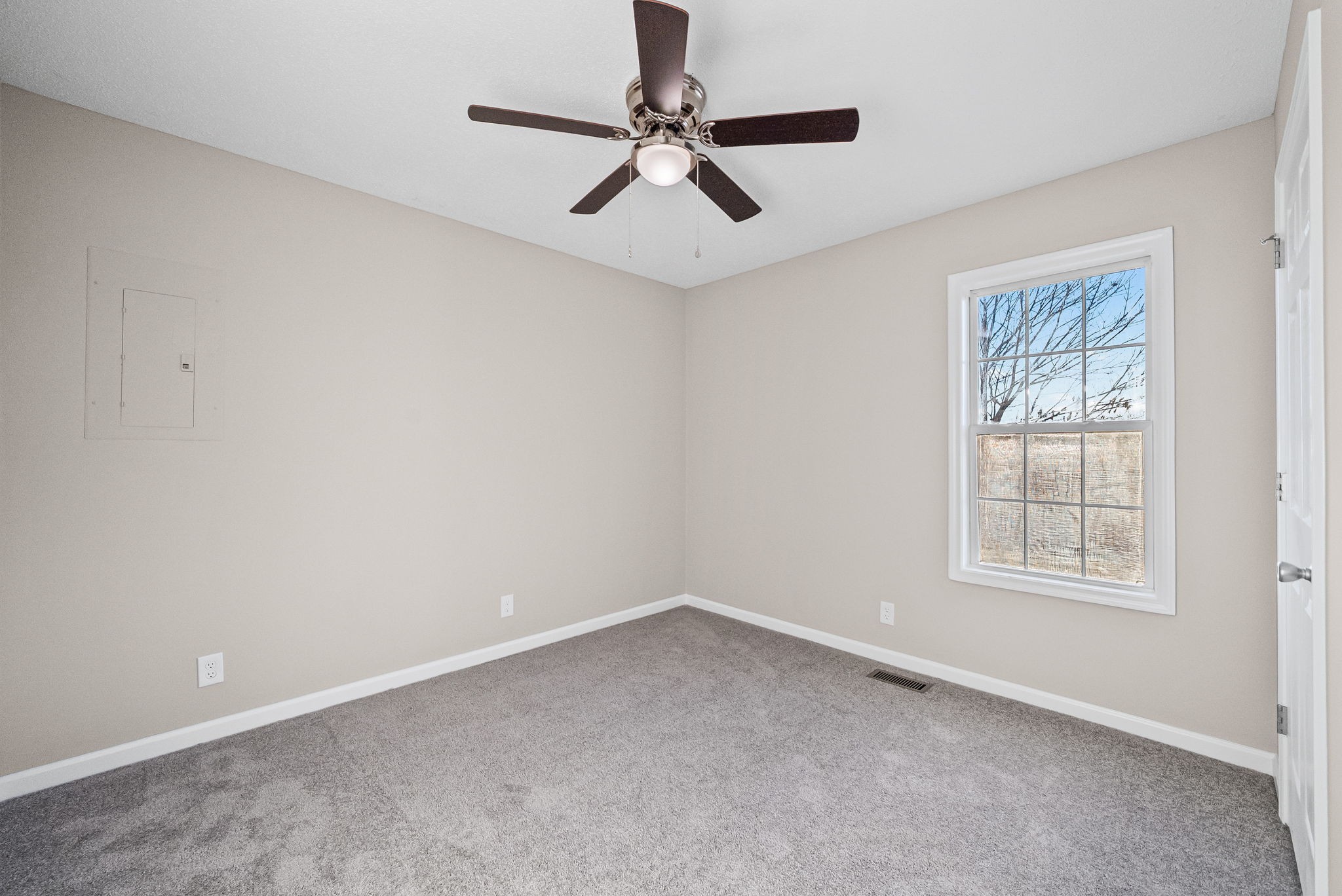 1010 Winesap Road Clarksville, TN 37040 - Photo 19 of 22 an empty room with windows and fan