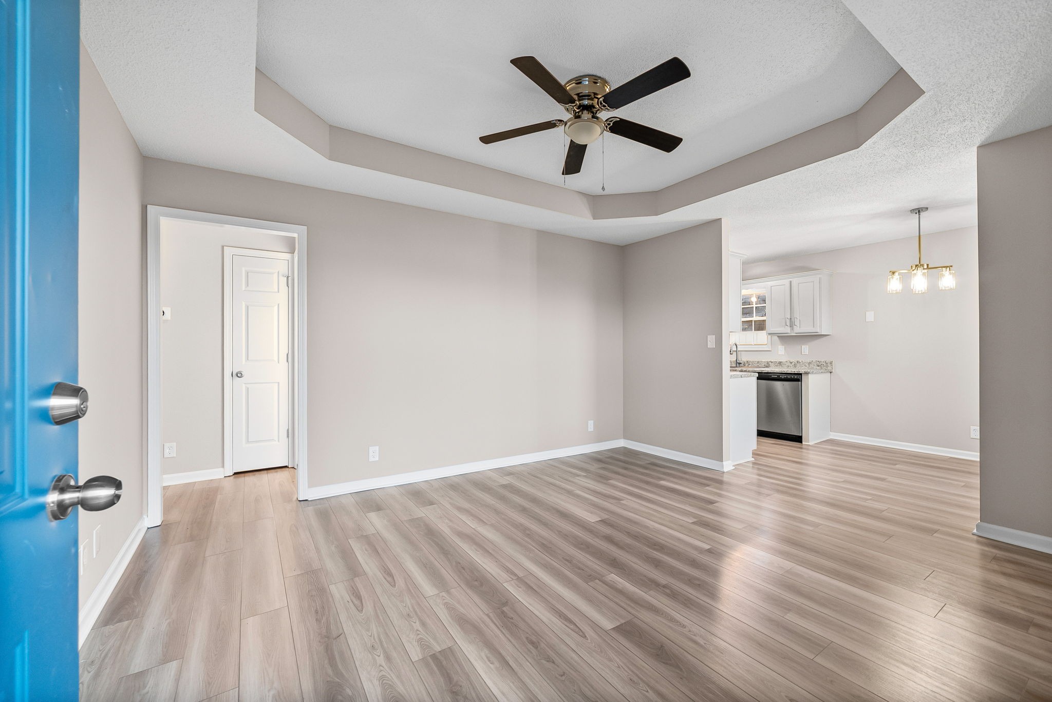 1010 Winesap Road Clarksville, TN 37040 - Photo 3 of 22 an empty room with wooden floor and a ceiling fan