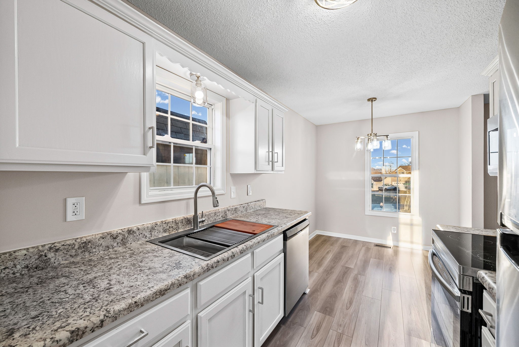 1010 Winesap Road Clarksville, TN 37040 - Photo 8 of 22 a kitchen that has a sink a stove and cabinets