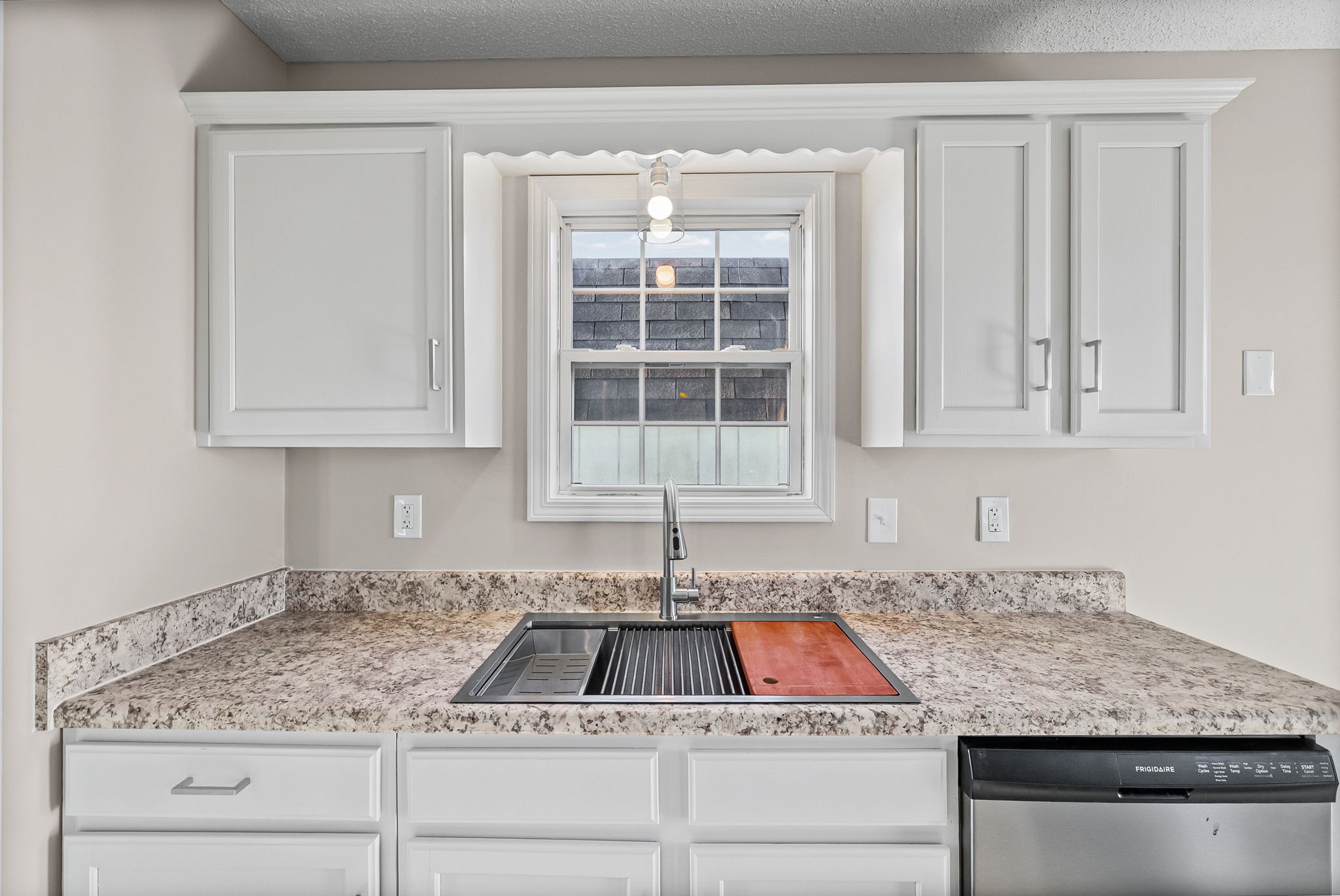 1010 Winesap Road Clarksville, TN 37040 - Photo 9 of 22 a kitchen with granite countertop a sink and white cabinets