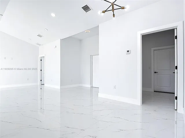 a kitchen with stainless steel appliances a refrigerator sink and cabinets