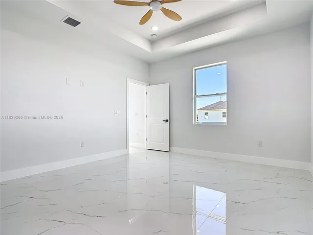 a spacious bathroom with a double vanity sink a mirror and shower