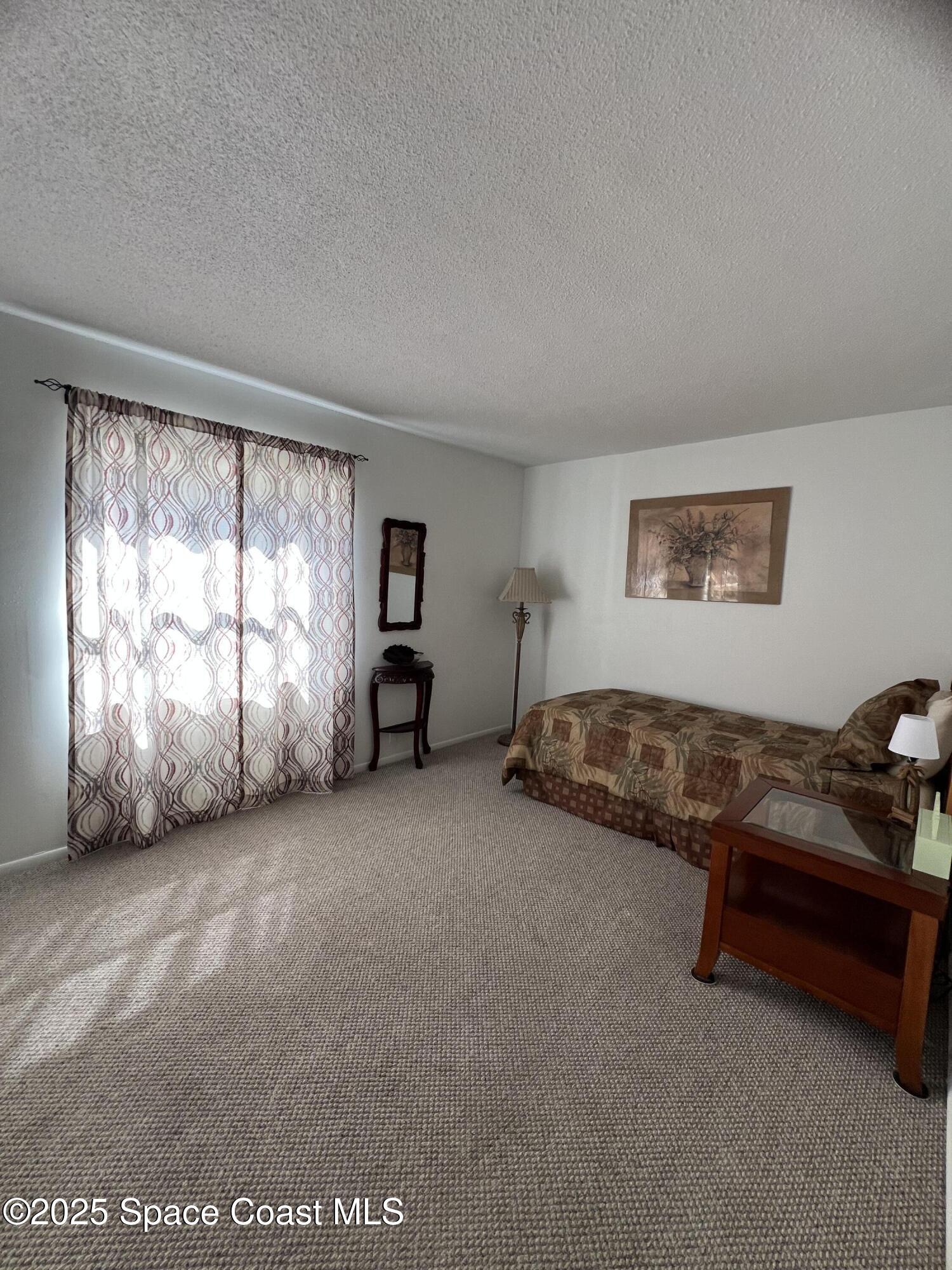 190 East Olmstead Drive, Unit E5 Titusville, FL 32780 - Photo 17 of 26 a big room with windows and closet