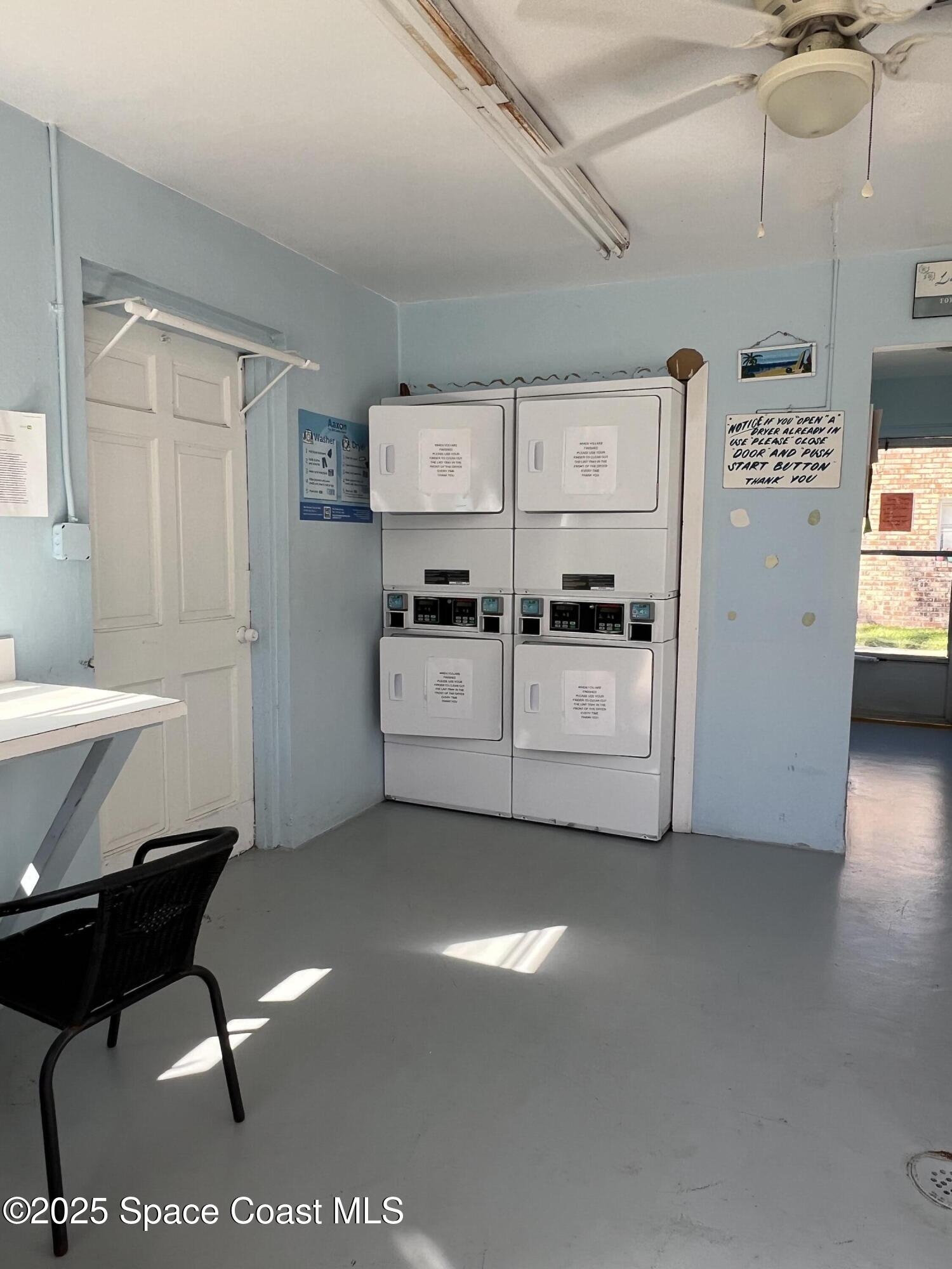 190 East Olmstead Drive, Unit E5 Titusville, FL 32780 - Photo 19 of 26 a view of a livingroom with furniture and kitchen