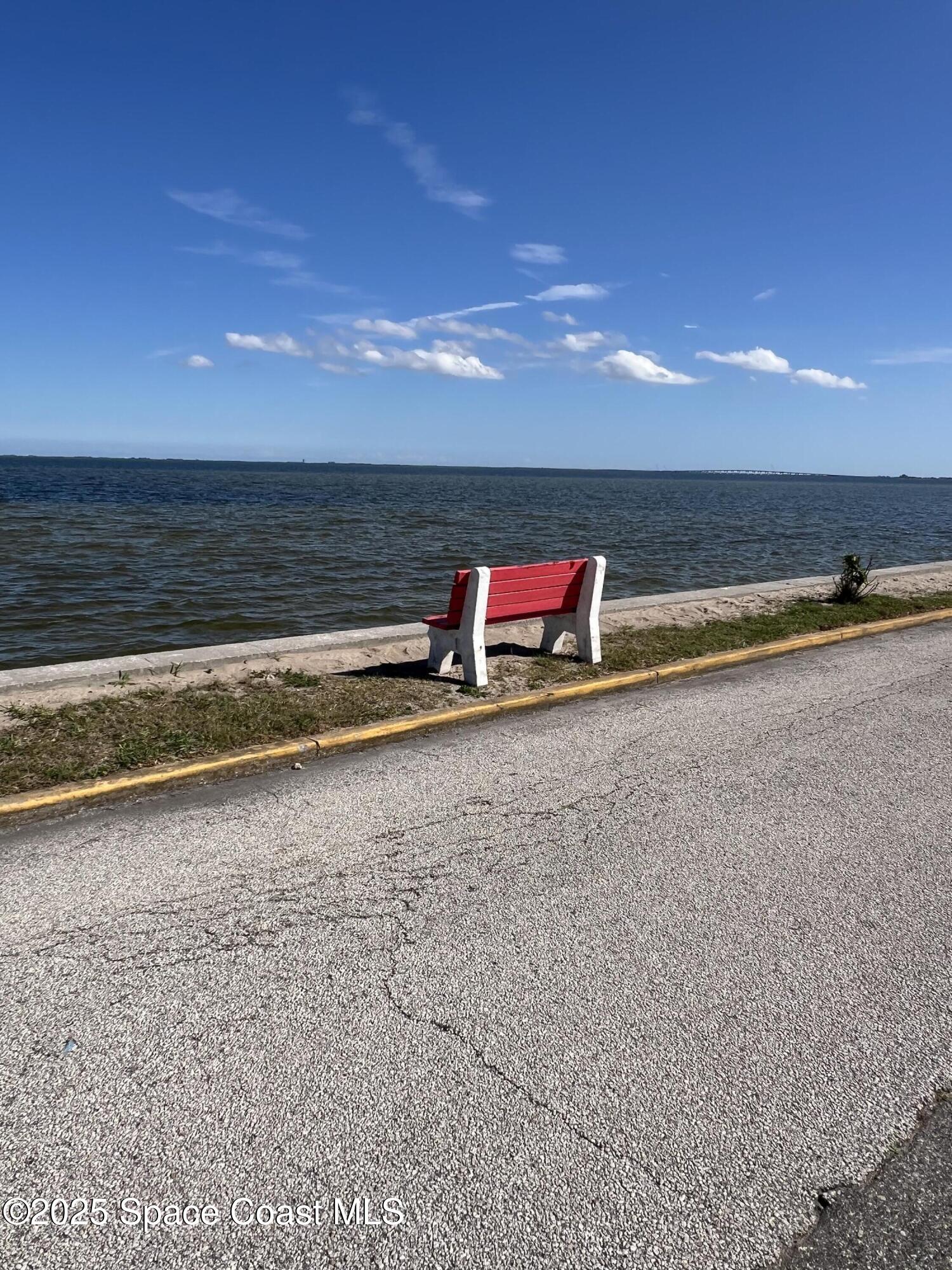 190 East Olmstead Drive, Unit E5 Titusville, FL 32780 - Photo 23 of 26 a view of swimming pool with outdoor seating and yard in back