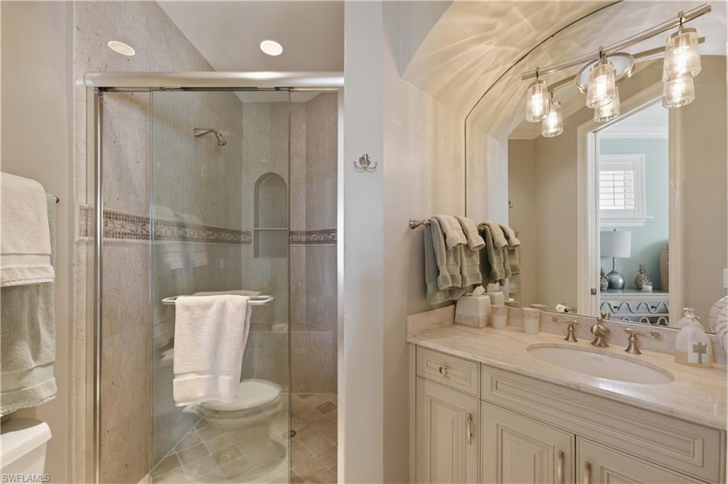361 Pirates Bight Naples, FL 34103 - Photo 32 of 45 a bathroom with a granite countertop sink toilet and shower