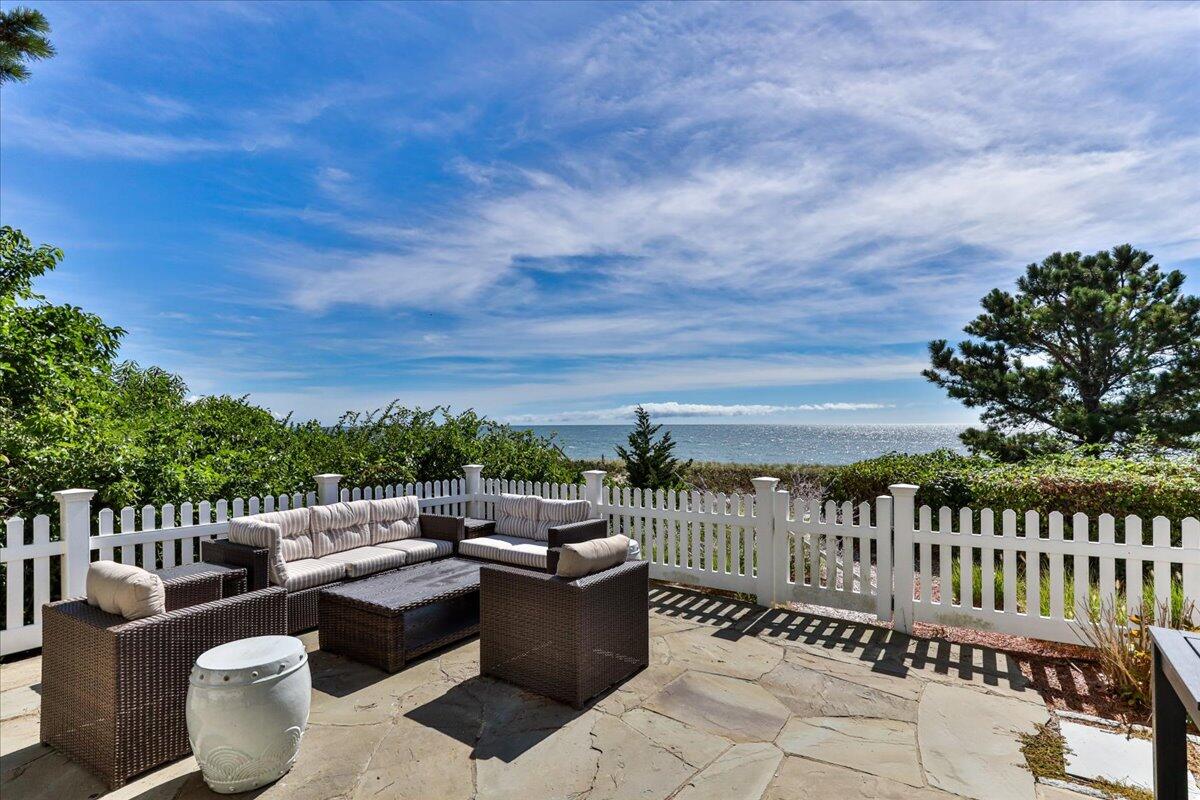 5 Ocean Bluff Drive Mashpee, MA 02649 - Photo 54 of 74 a view of a roof deck with couches and wooden floor