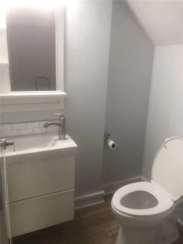 a bathroom with a toilet and a sink