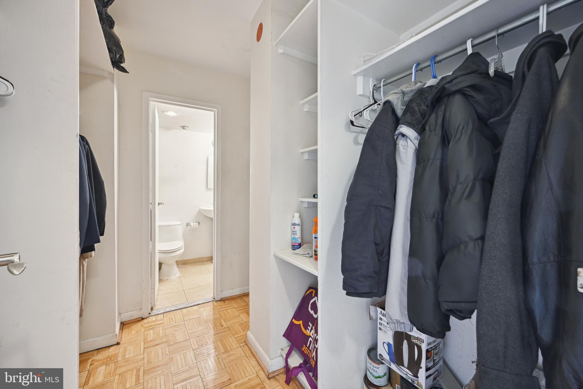 950 25th Street Northwest, Unit 814N Washington, DC 20037 - Photo 18 of 44 a view of walk in closet with clothes and shoes