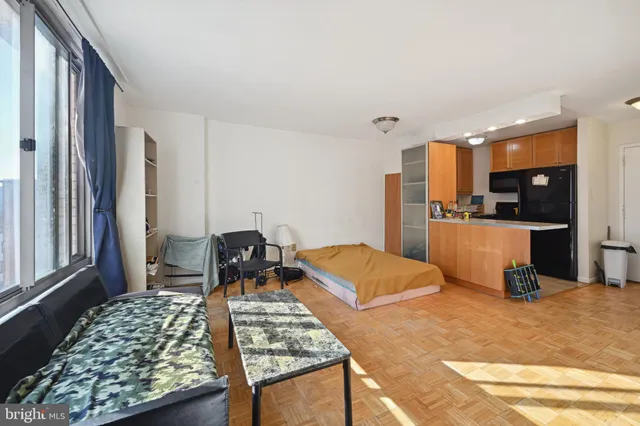 a bedroom with bed and window