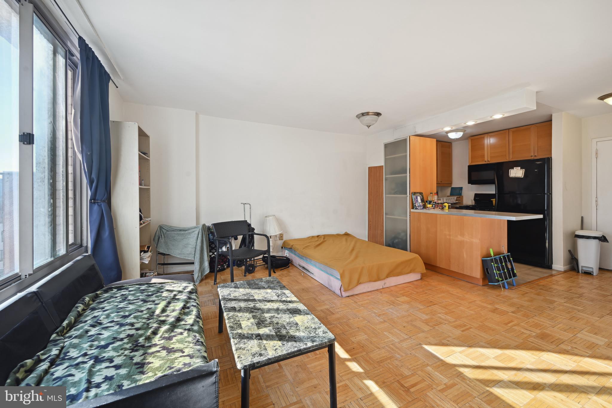 950 25th Street Northwest, Unit 814N Washington, DC 20037 - Photo 20 of 44 a bedroom with a bed and a view of living room