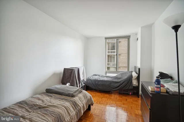 a living room with furniture large window and a table