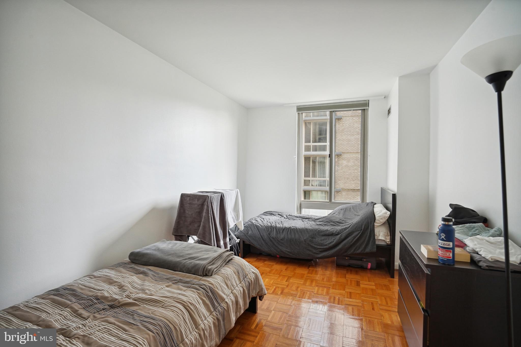 950 25th Street Northwest, Unit 814N Washington, DC 20037 - Photo 21 of 44 a bedroom with bed and window