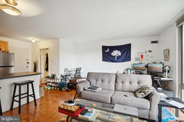 a kitchen with stainless steel appliances granite countertop a refrigerator a sink a stove and island