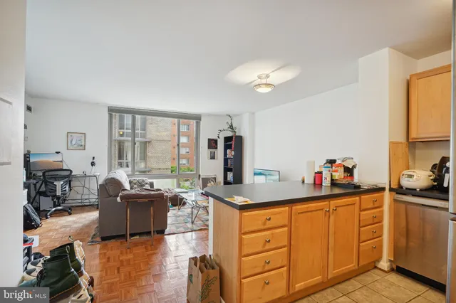 a kitchen with a sink a stove and cabinets