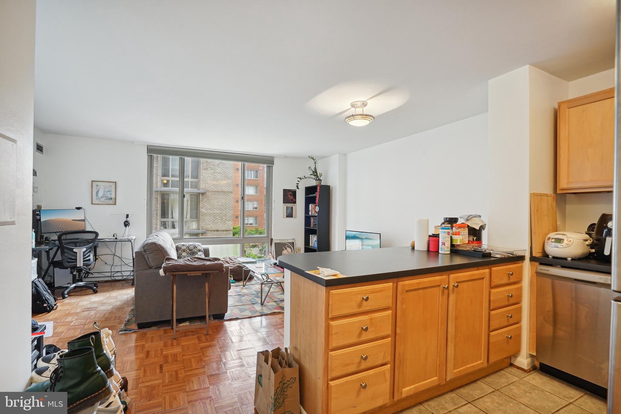 950 25th Street Northwest, Unit 814N Washington, DC 20037 - Photo 37 of 44 a kitchen that has cabinets a sink and appliances