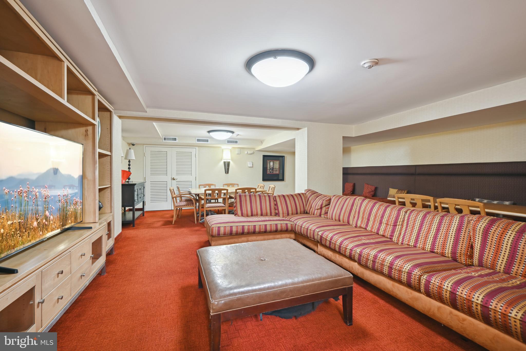 950 25th Street Northwest, Unit 814N Washington, DC 20037 - Photo 39 of 44 a living room with furniture a rug and a large window