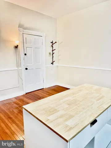 a bedroom with a bed and mirror