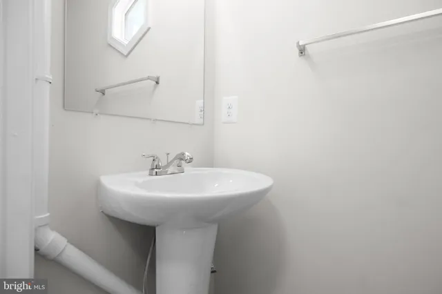 a white sink sitting next to a white sink