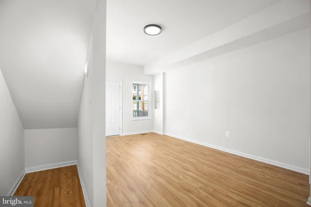 a view of livingroom with hardwood floor and a ceiling fan
