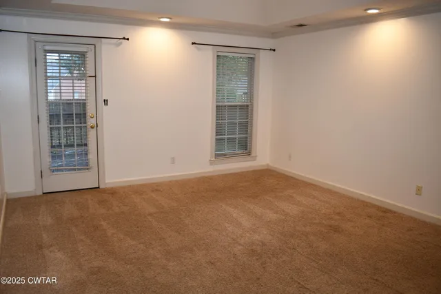 a white bath tub sitting next to a toilet