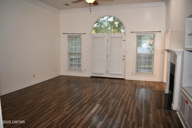 a kitchen with granite countertop a sink a stove and refrigerator