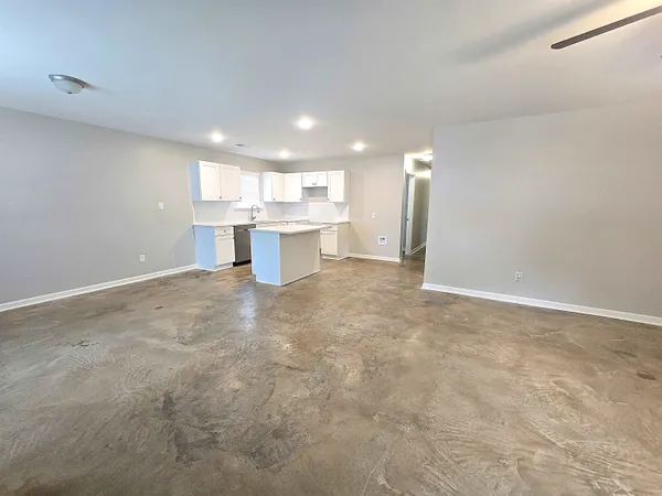 a utility room with cabinets washer and dryer