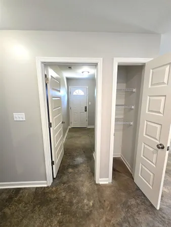 a large kitchen with lot of cabinets and sink