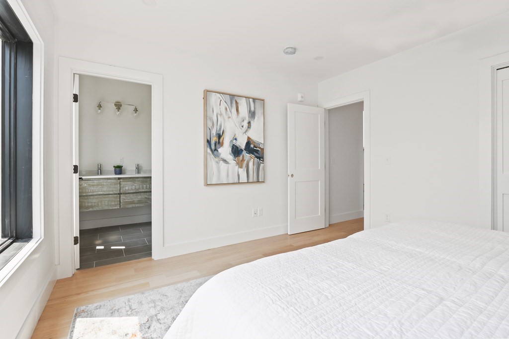 44 Cottage Street, Unit 2 Boston, MA 02128 - Photo 14 of 18 a bedroom with a bed and a window