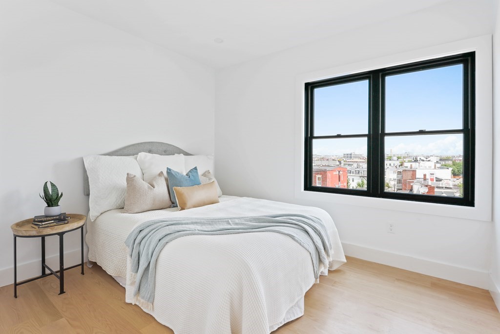 44 Cottage Street, Unit 2 Boston, MA 02128 - Photo 17 of 18 a bedroom with a bed and a window