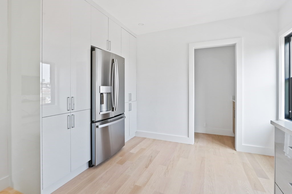 44 Cottage Street, Unit 2 Boston, MA 02128 - Photo 5 of 18 a view of kitchen with refrigerator and microwave