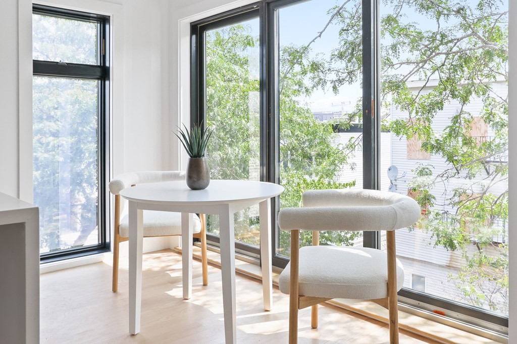 44 Cottage Street, Unit 2 Boston, MA 02128 - Photo 10 of 18 a dining room with furniture and wooden floor