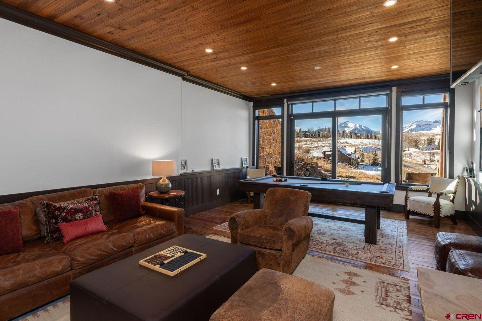 172 Adams Ranch Road Mountain Village, CO 81435 - Photo 20 of 29 a living room with furniture and a large window