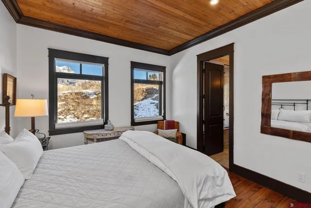 a bedroom with a large bed and a large window