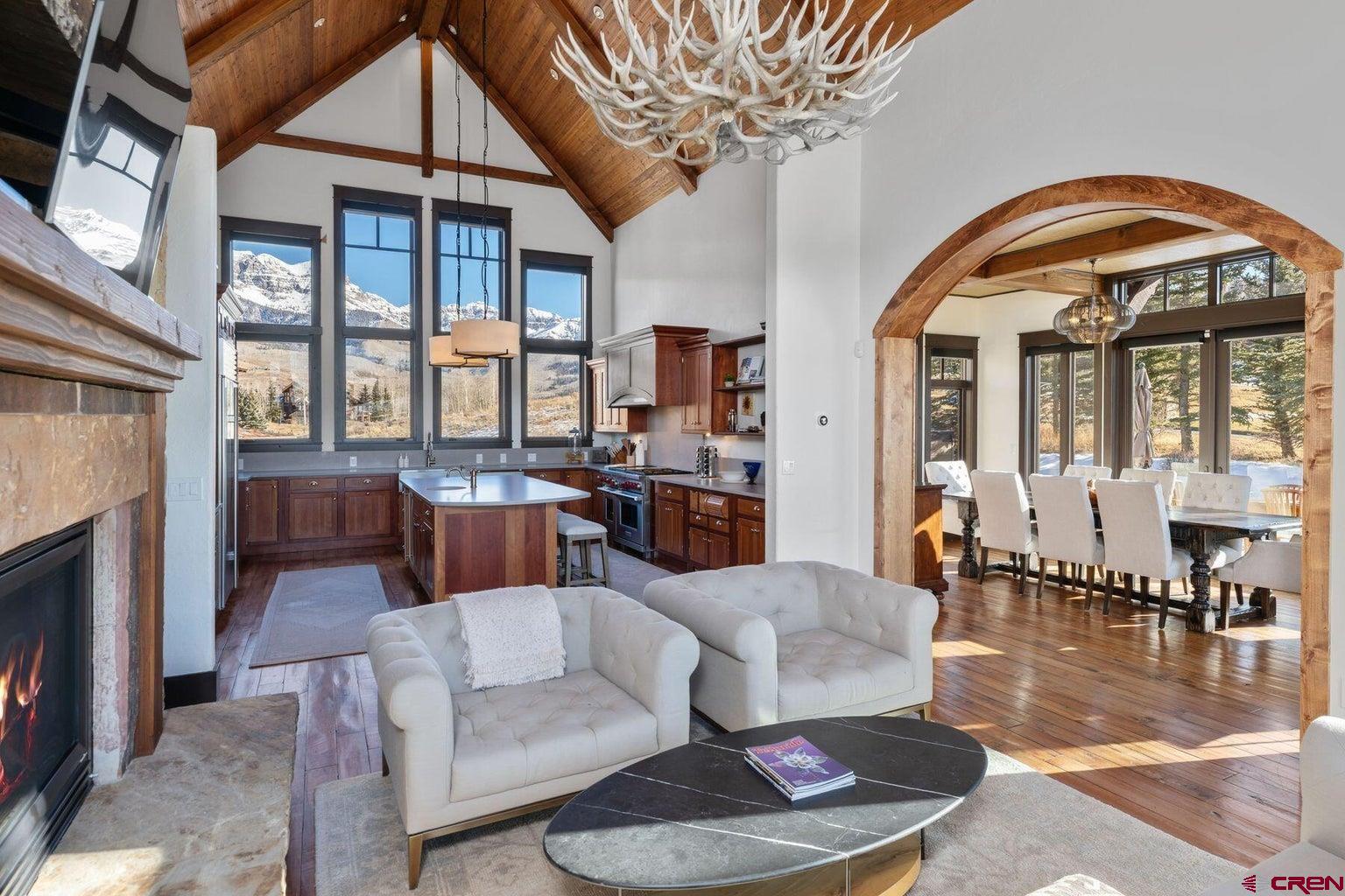 172 Adams Ranch Road Mountain Village, CO 81435 - Photo 6 of 29 a living room with furniture and a fireplace