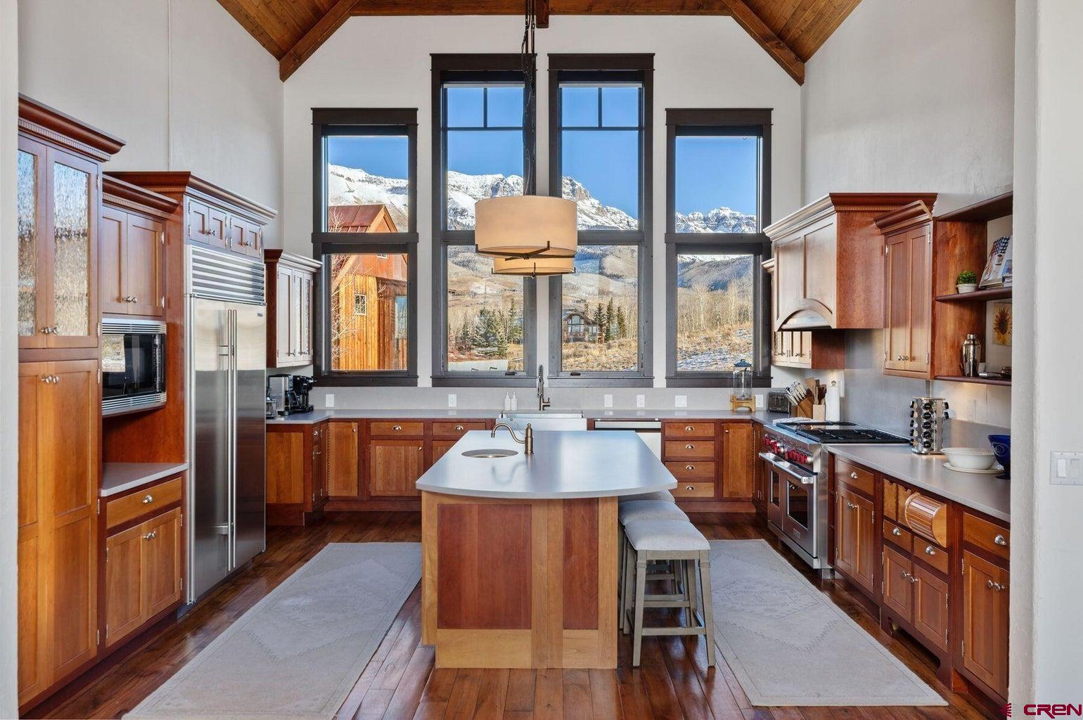 172 Adams Ranch Road Mountain Village, CO 81435 - Photo 7 of 29 a large kitchen with stainless steel appliances granite countertop a stove a sink and a refrigerator