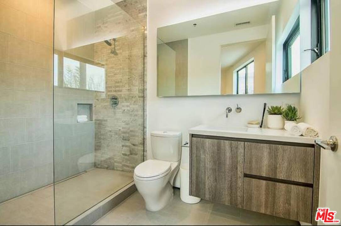 2021 Walnut Avenue Venice, CA 90291 - Photo 11 of 23 a bathroom with a sink a toilet and shower