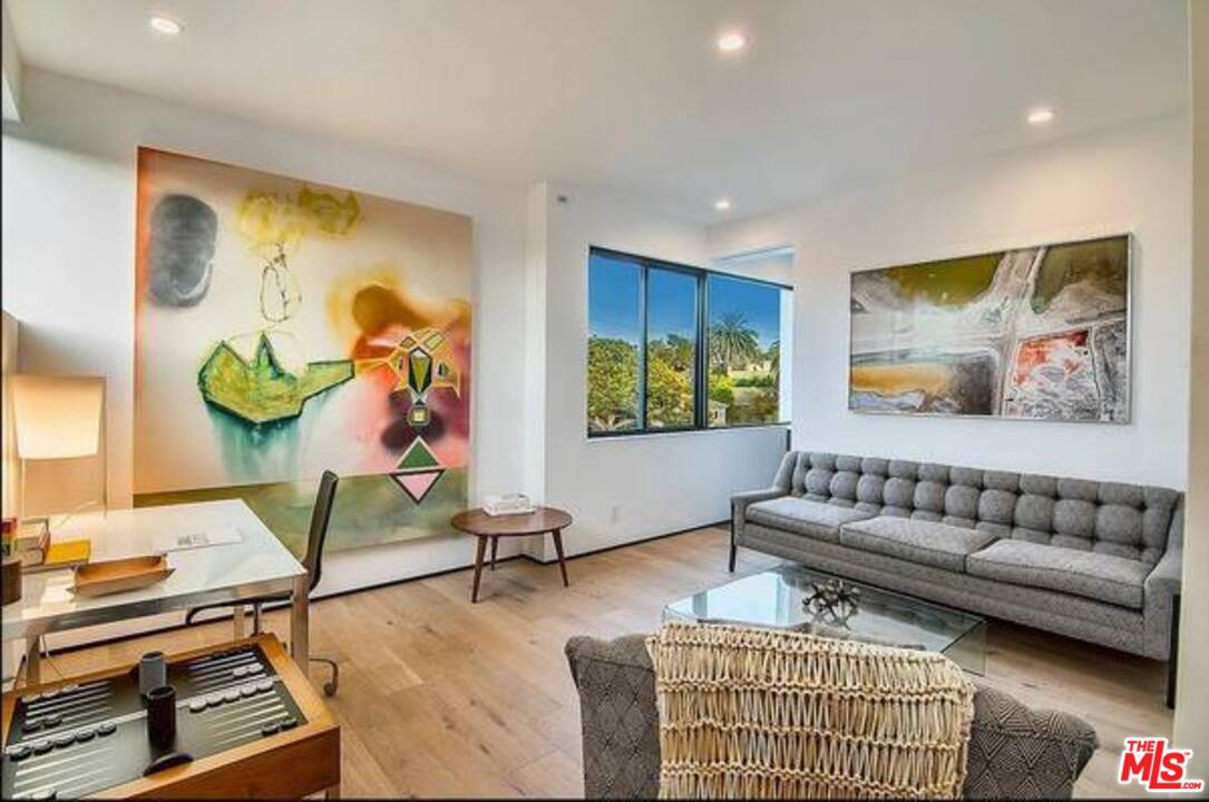 2021 Walnut Avenue Venice, CA 90291 - Photo 12 of 23 a living room with furniture and a flat screen tv