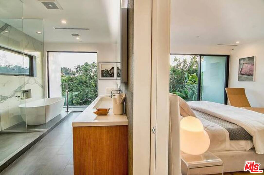 2021 Walnut Avenue Venice, CA 90291 - Photo 19 of 23 a bedroom with furniture and a large window