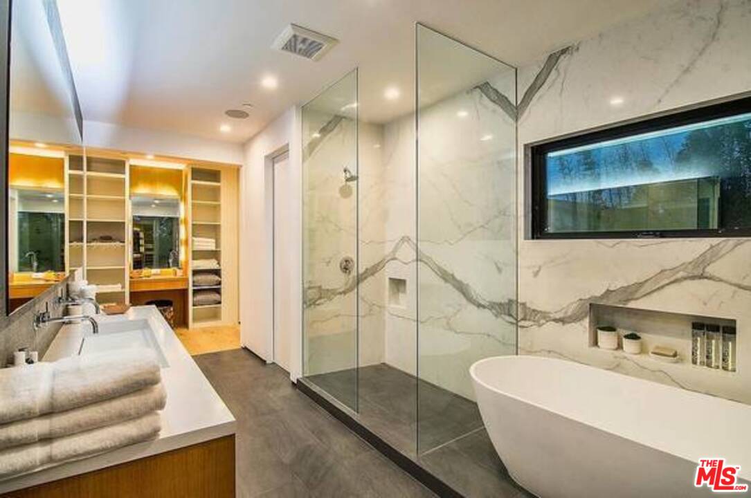2021 Walnut Avenue Venice, CA 90291 - Photo 20 of 23 a spacious bathroom with a double vanity sink a mirror and a shower