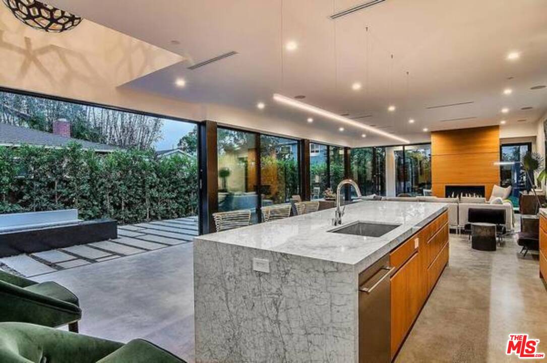 2021 Walnut Avenue Venice, CA 90291 - Photo 4 of 23 a kitchen with stainless steel appliances granite countertop a sink and a large window
