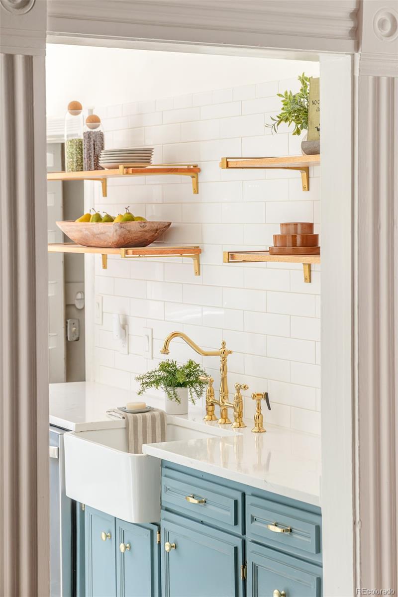 3042 West 24th Avenue Denver, CO 80211 - Photo 12 of 32 a bathroom with a sink and a window