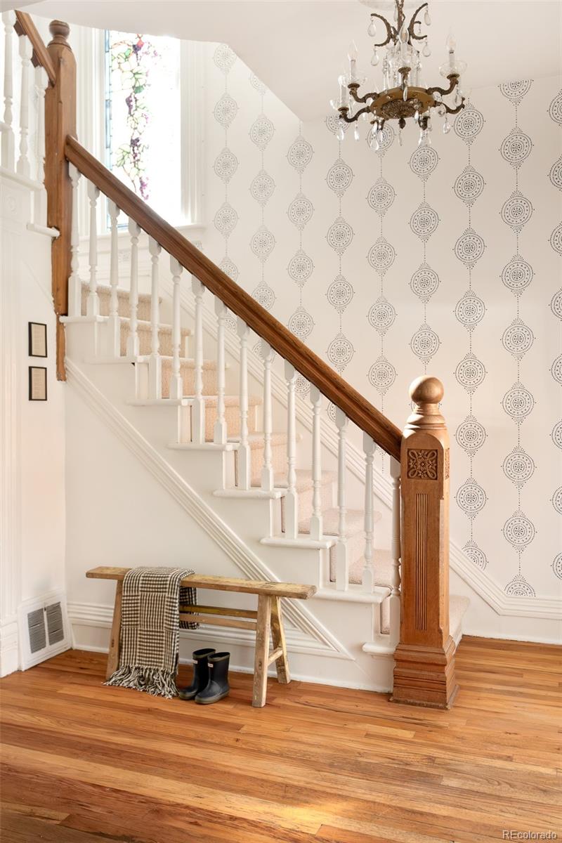3042 West 24th Avenue Denver, CO 80211 - Photo 19 of 32 a view of entryway and hall with wooden floor
