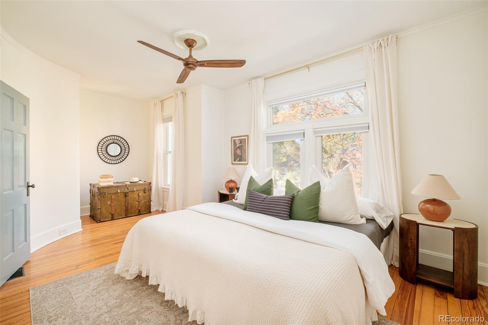 3042 West 24th Avenue Denver, CO 80211 - Photo 22 of 32 a bedroom with a bed and a window