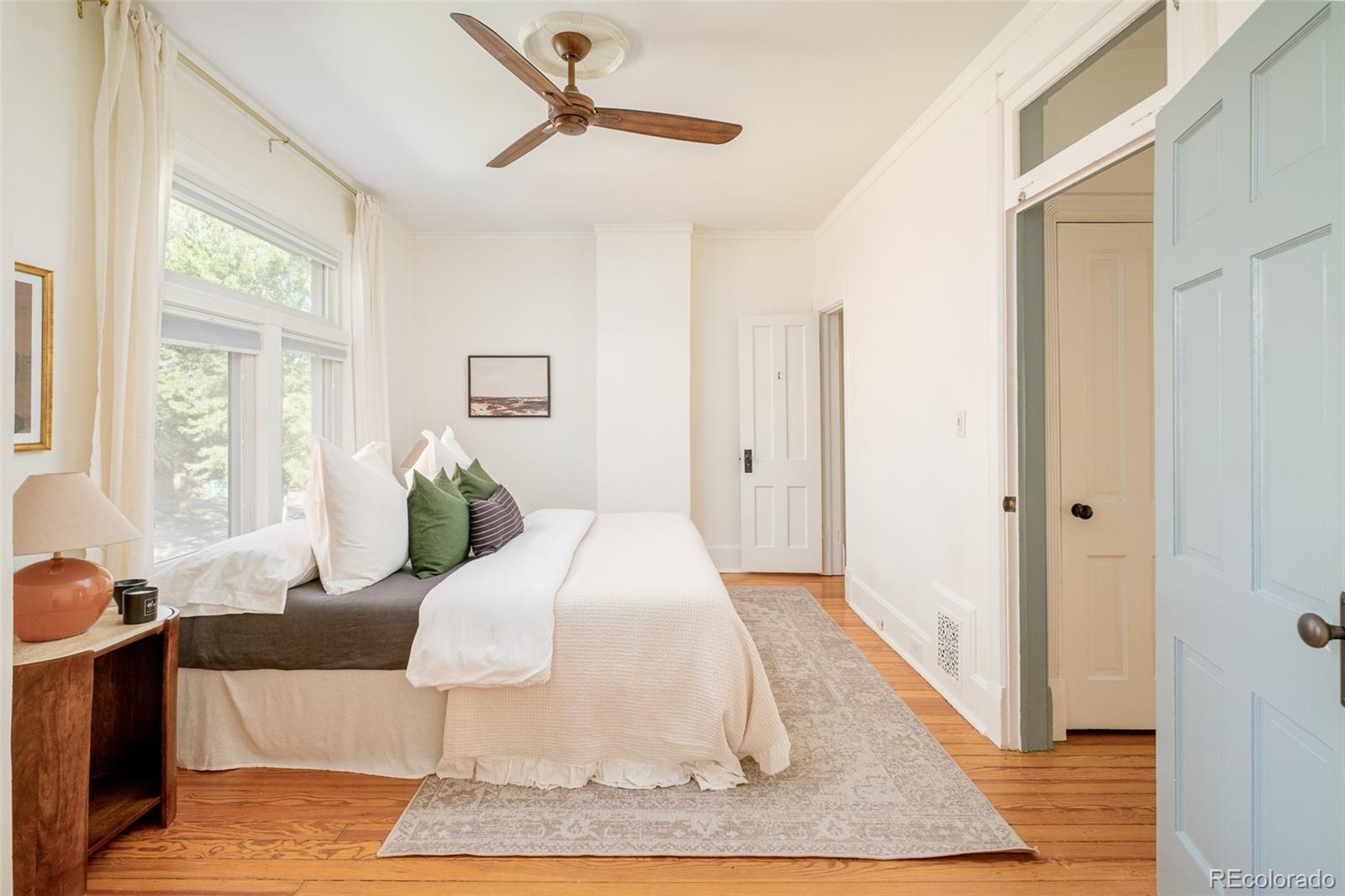 3042 West 24th Avenue Denver, CO 80211 - Photo 23 of 32 a living room with a bed and a rug