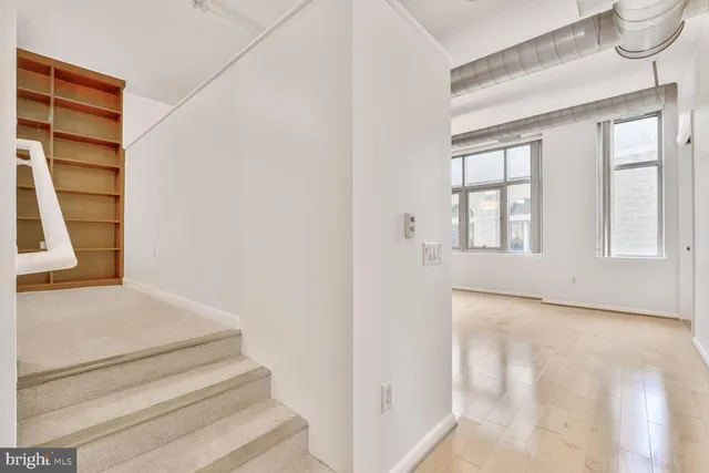 a view of an empty room with a window