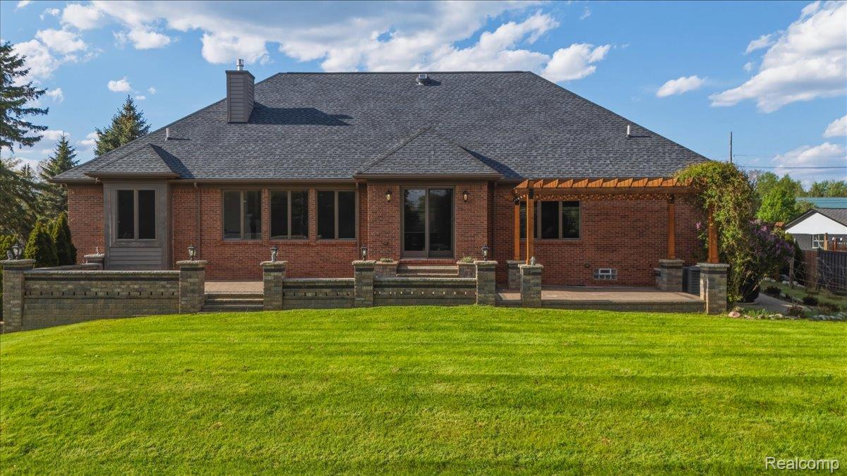 35339 West 13 Mile Road Farmington, MI 48331 - Photo 57 of 72 Rear view of property with brick siding, a patio area, a chimney, and a pergola